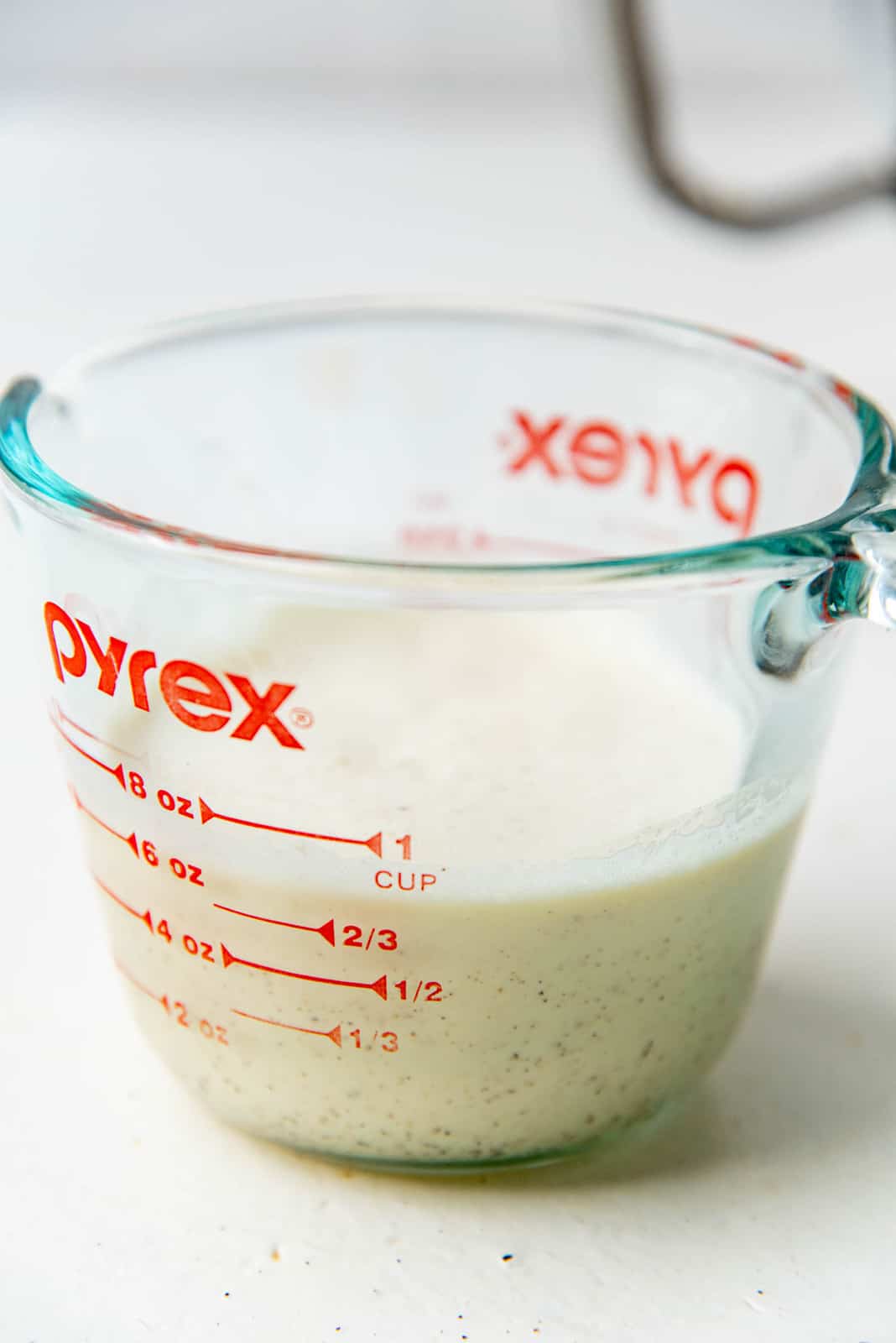 Homemade eggnog in a measuring cup