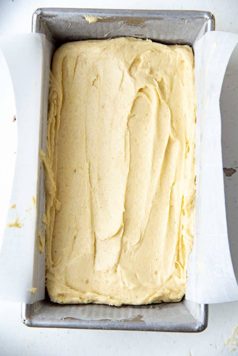 Spread out eggnog cake batter in the loaf pan