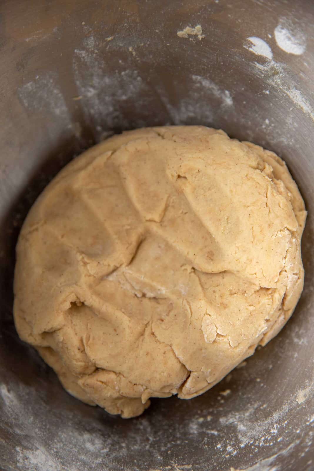 The linzer cookie dough in the mixer bowl
