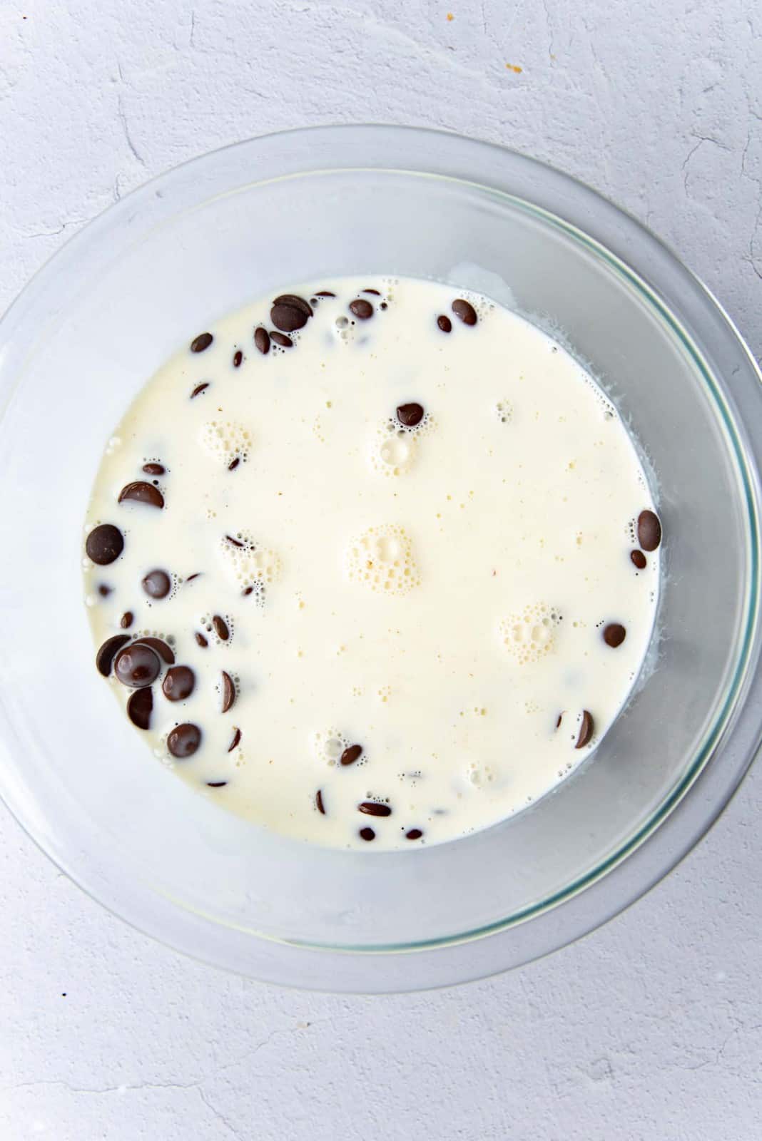 Hot cream poured over the chocolate