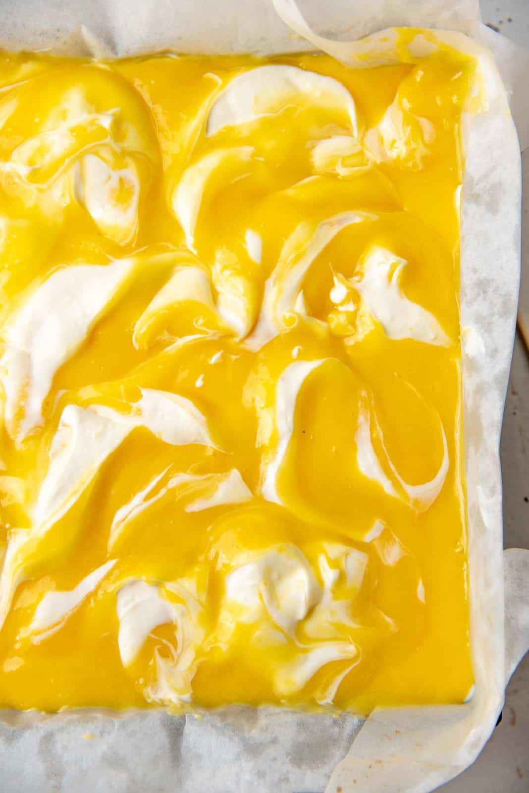 The lemon curd swirled in with the cheesecake layer in the pan.