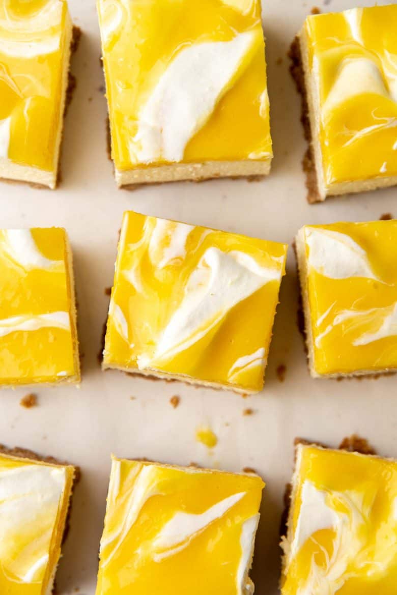 A close up of the lemon curd swirls in the cheesecake bars