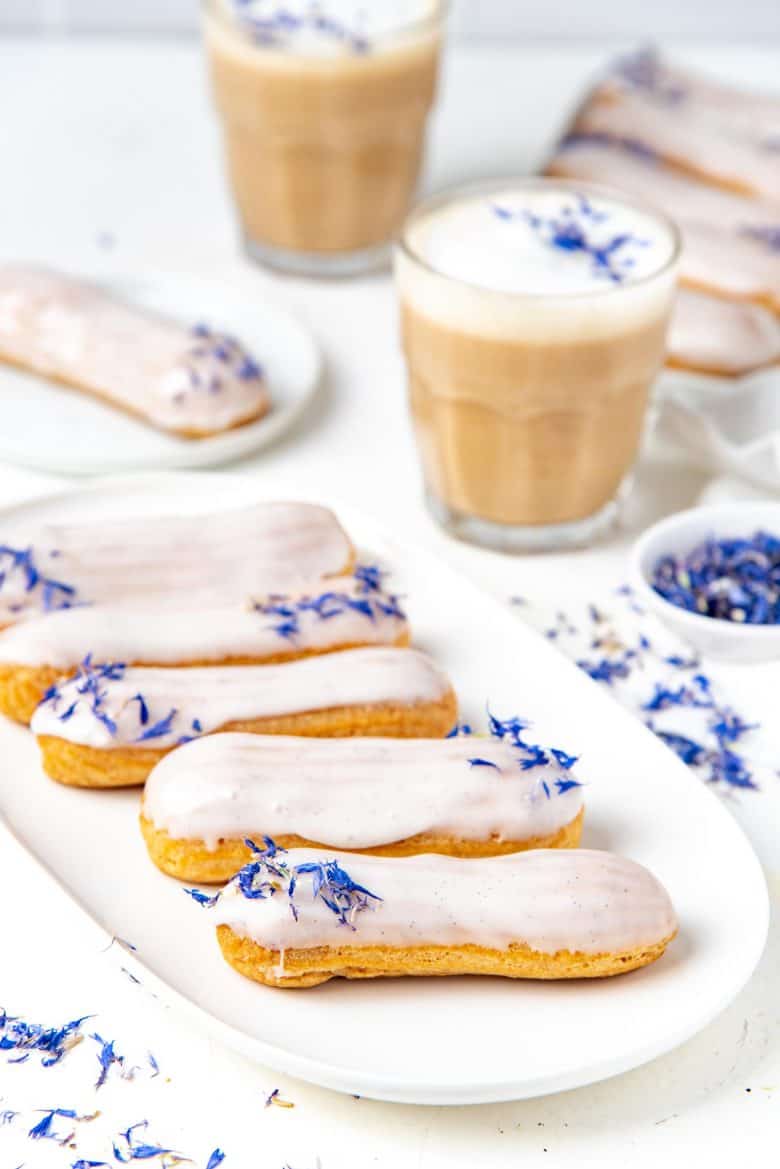 Earl grey eclairs served on a white platter 