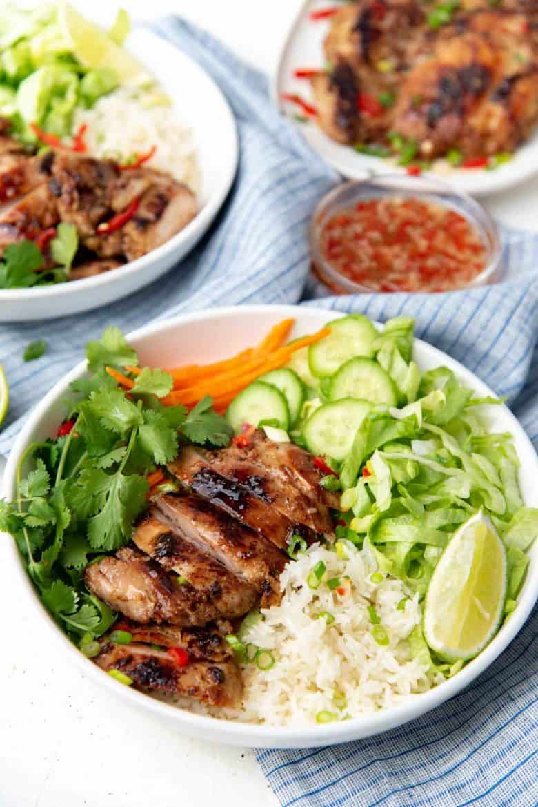 Lemongrass chicken serves with salad in a rice bowl