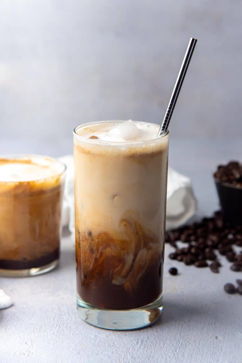Iced brown sugar oat milk shaken espresso in a glass