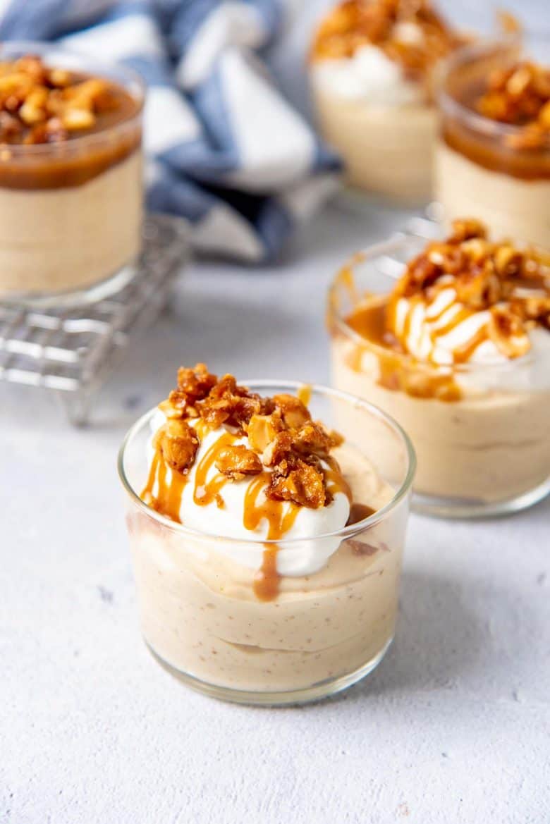 Butterscotch mousse served with whipped cream and butterscotch sauce