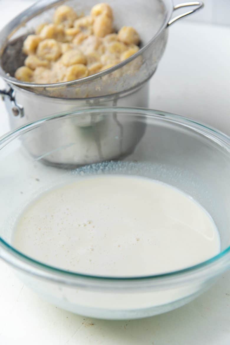 The milk infused with banana flavor in a bowl