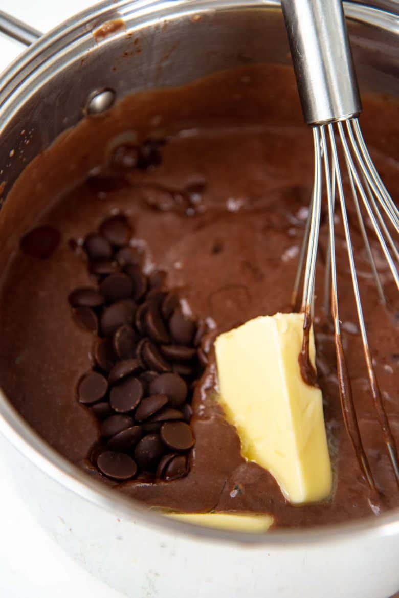 Whisking in chocolate chips and butter into the custard base