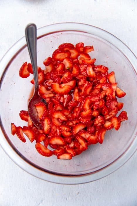 Strawberries mixed with sugar and cardamom