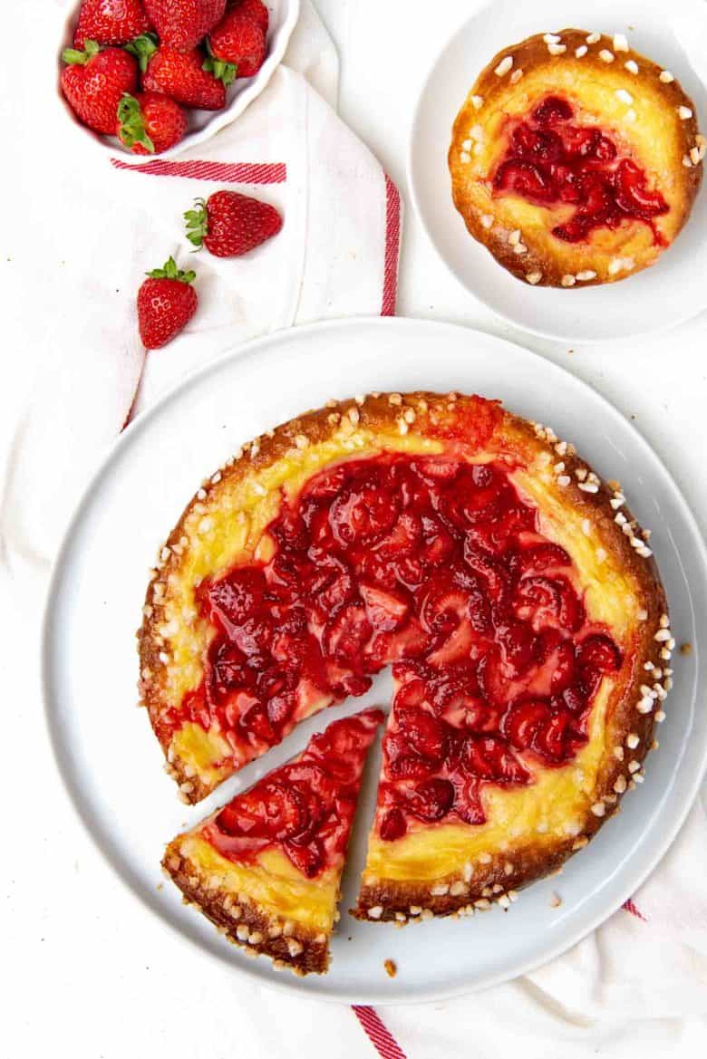 Overhead view of the strawberry brioche tart, with a slice cut