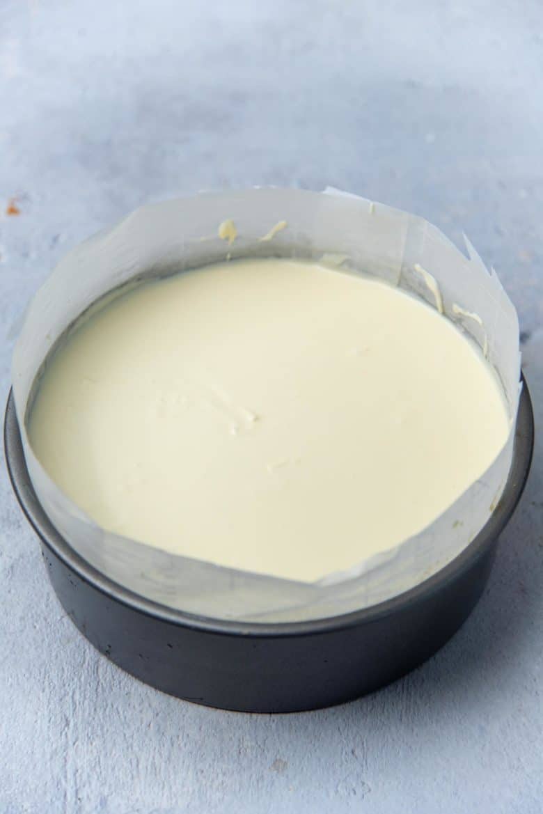 Cheesecake batter poured into prepared pan