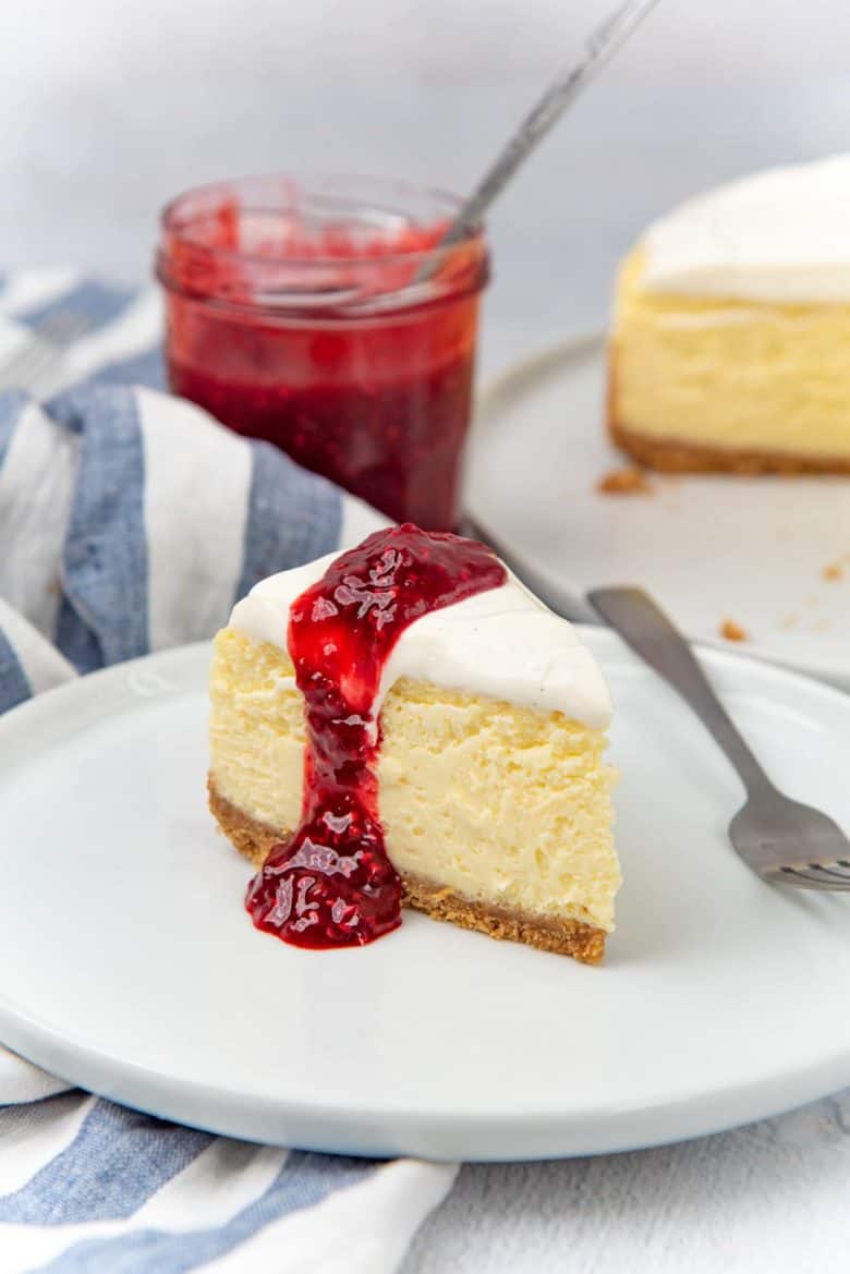 New York cheesecake served with raspberry coulis