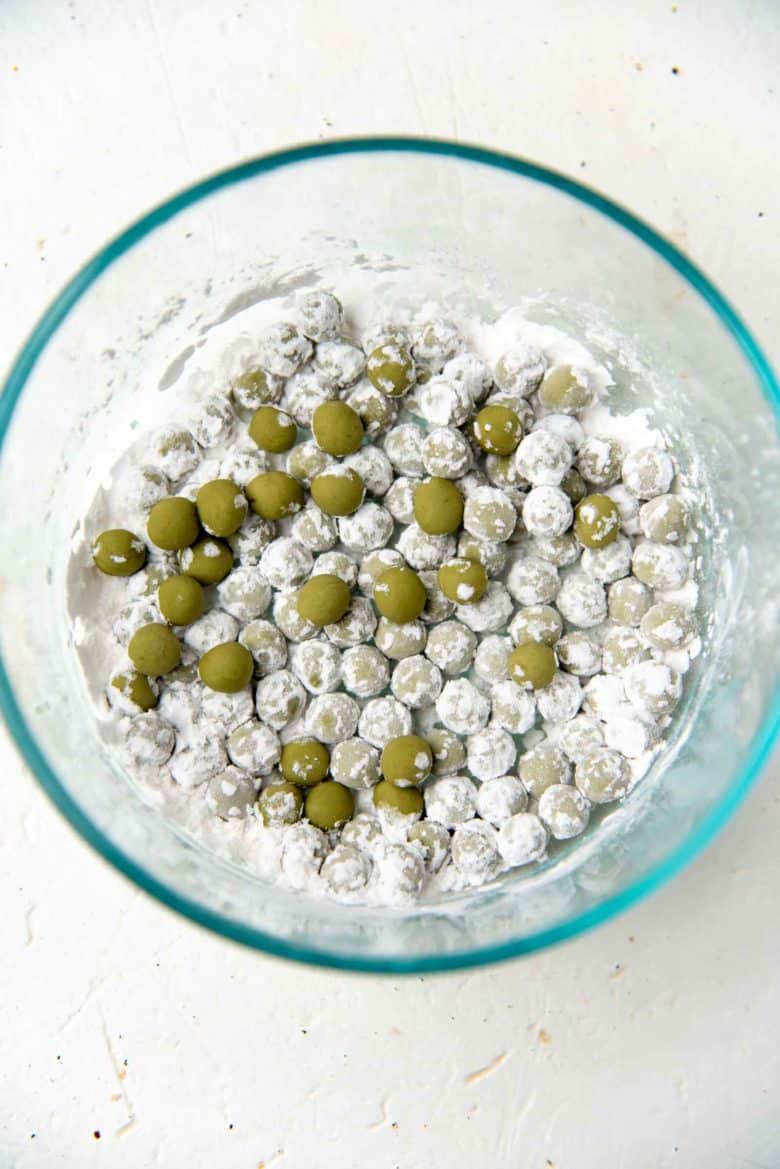 Rolled matcha boba pearls coated in starch