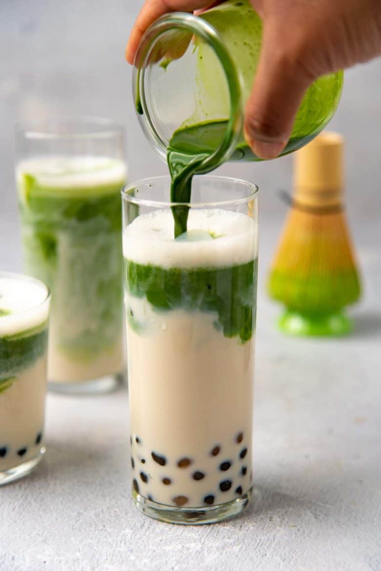 pouring matcha into the milk