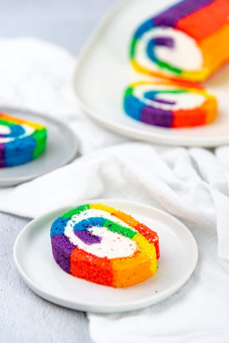 Slice of rainbow swiss roll cake
