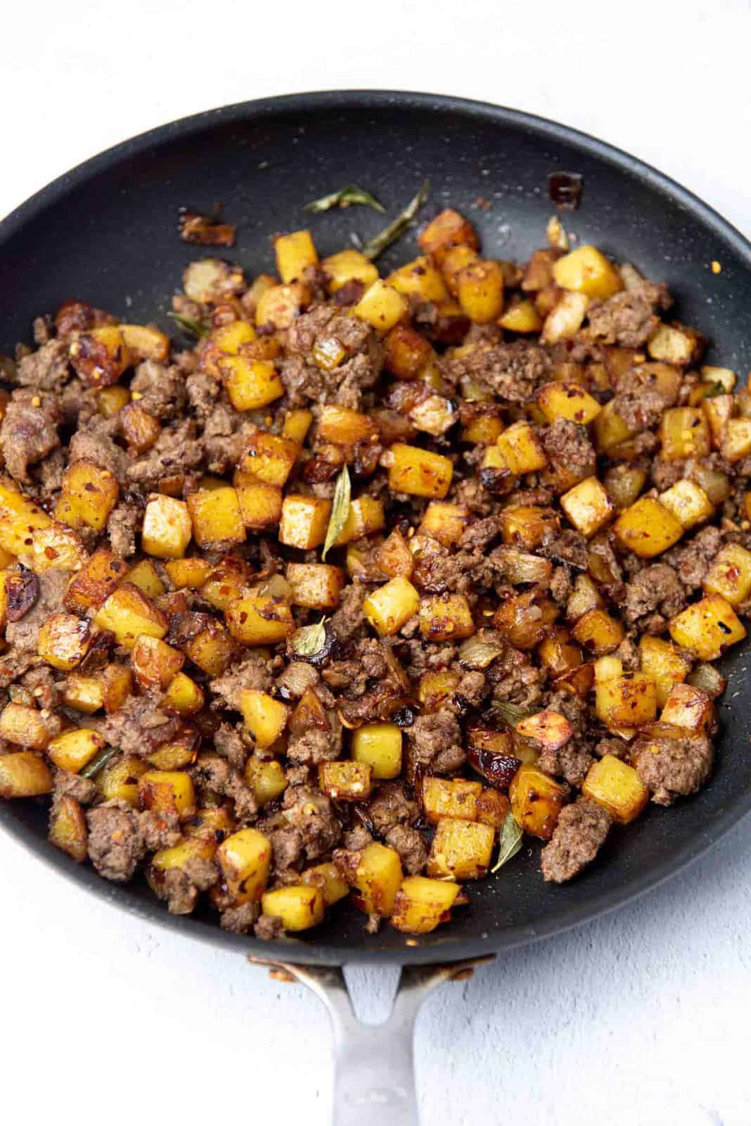 Potato homefries mixed with curries ground meat