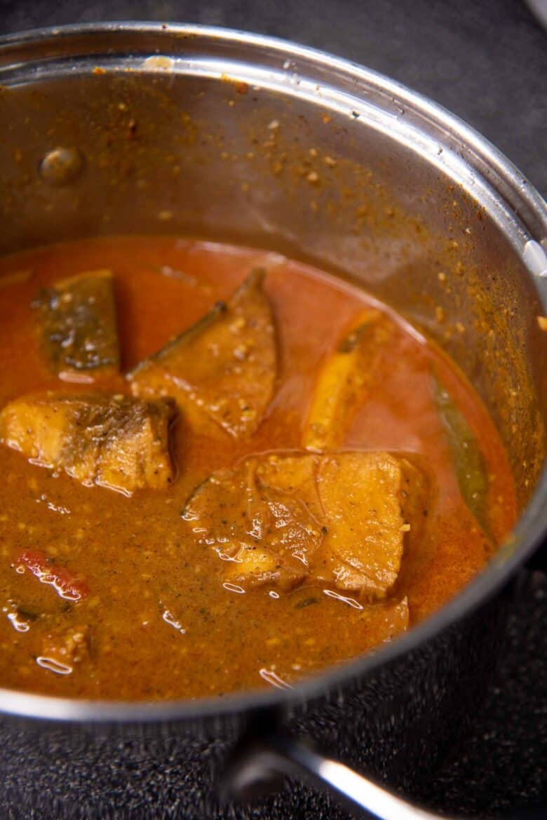 The fish curry after simmering to cook the fish