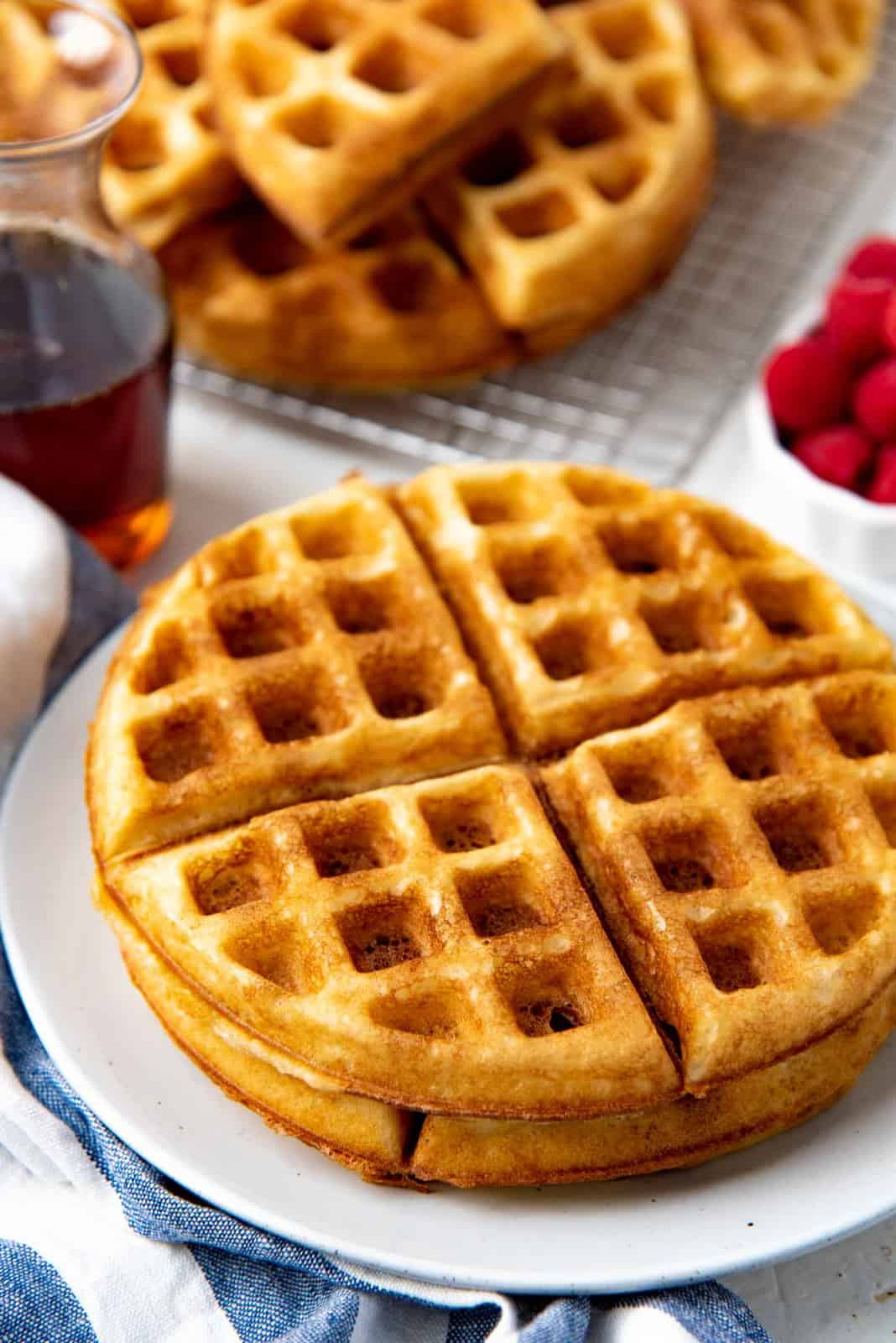 A close up of the crispy waffle on a white plate