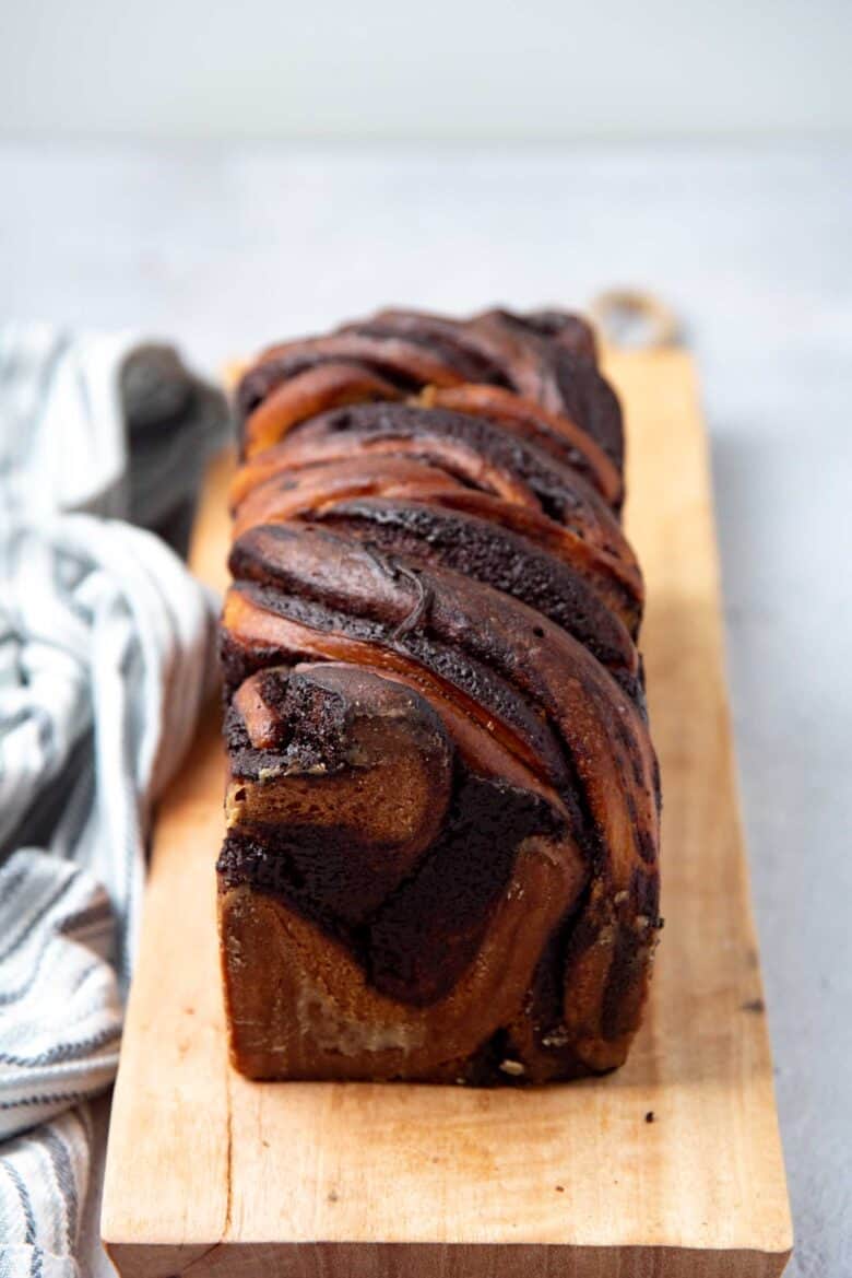 A front view of the babka loaf on a cutting board