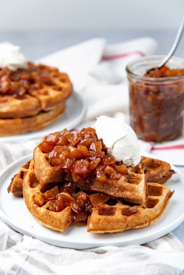 Spiced waffles (overnight yeasted), served with caramel apples with whipped cream on top