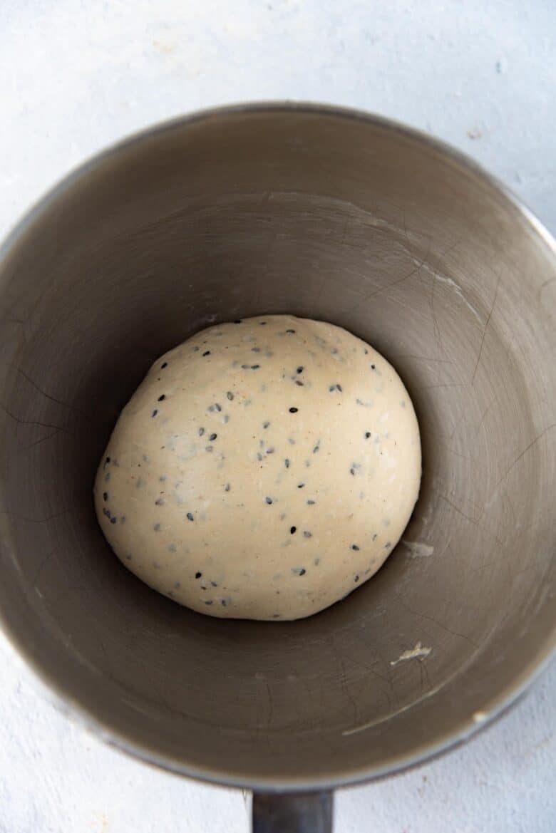 The dough shaped into a bowl, inside a mixer bowl