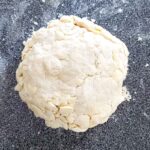 The pie dough after being stacked and shaped.