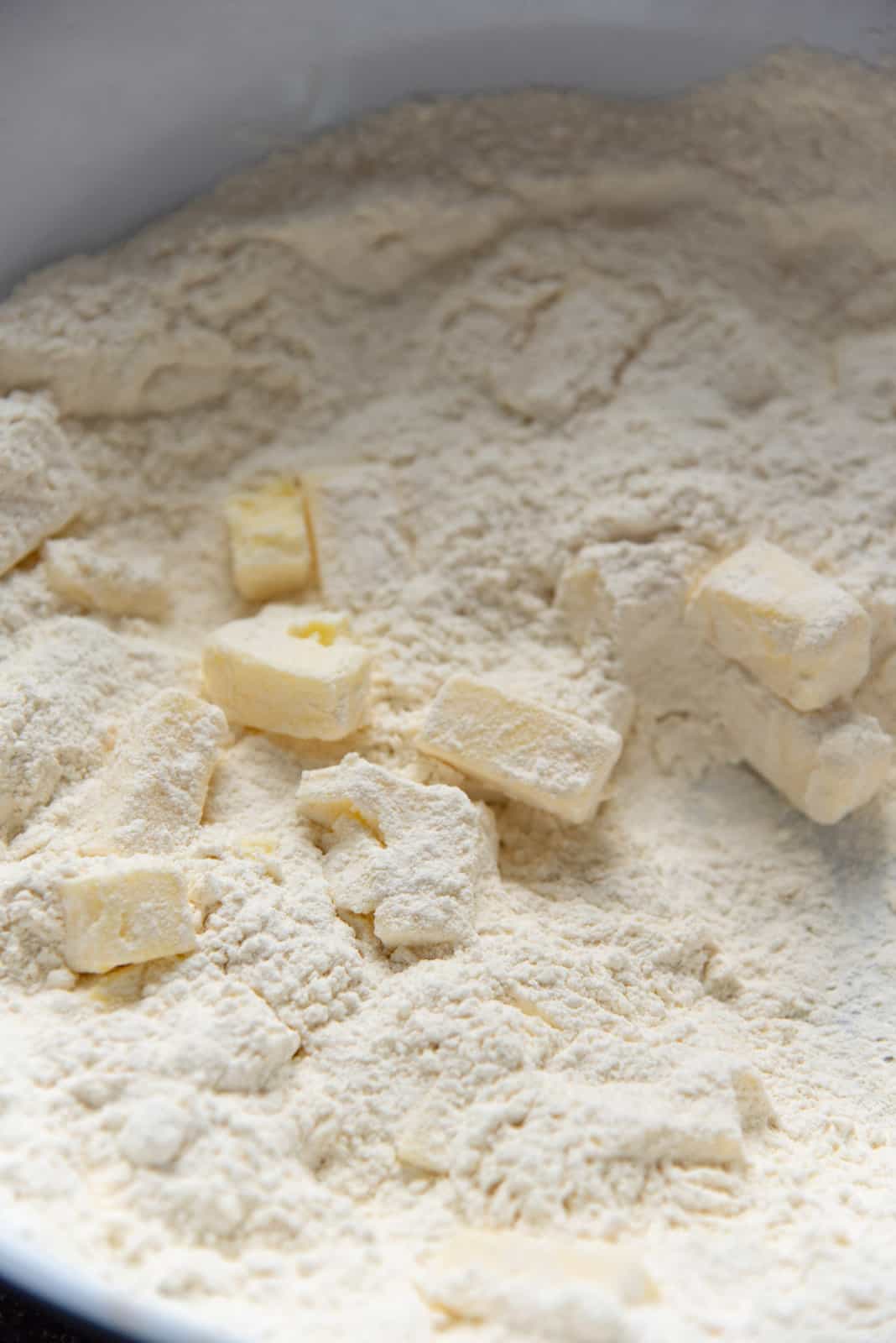 The cubed butter tossed in the flour.