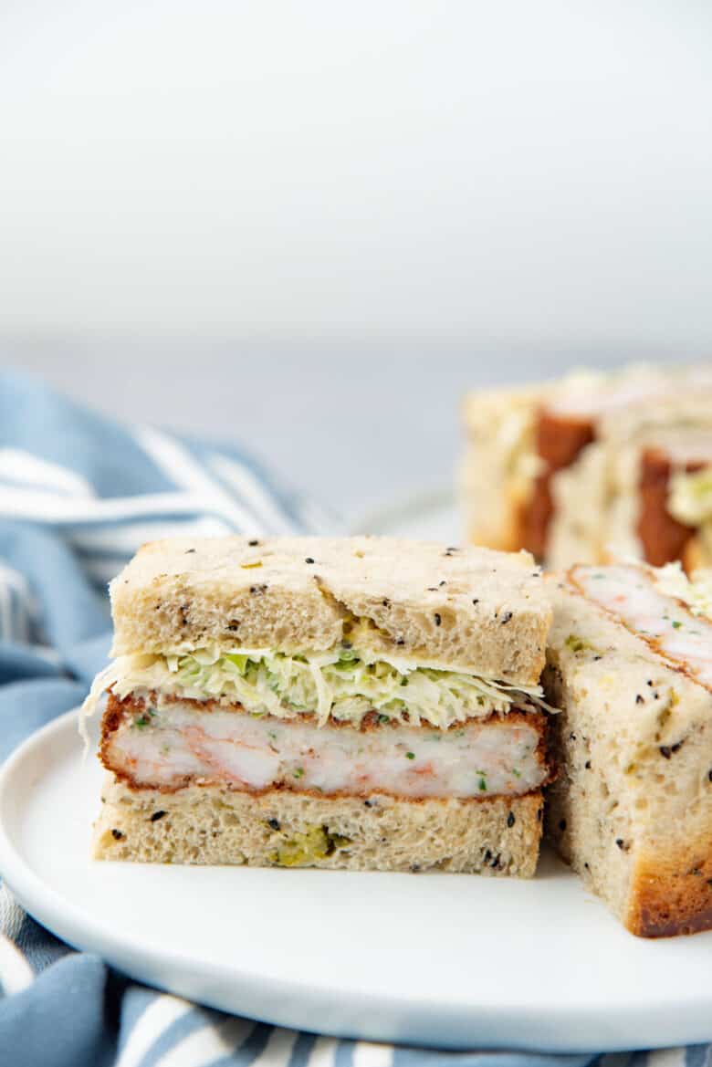 Ebi Katsu sando or sandwich cut in half to show the cross section of the shrimp cutlet.