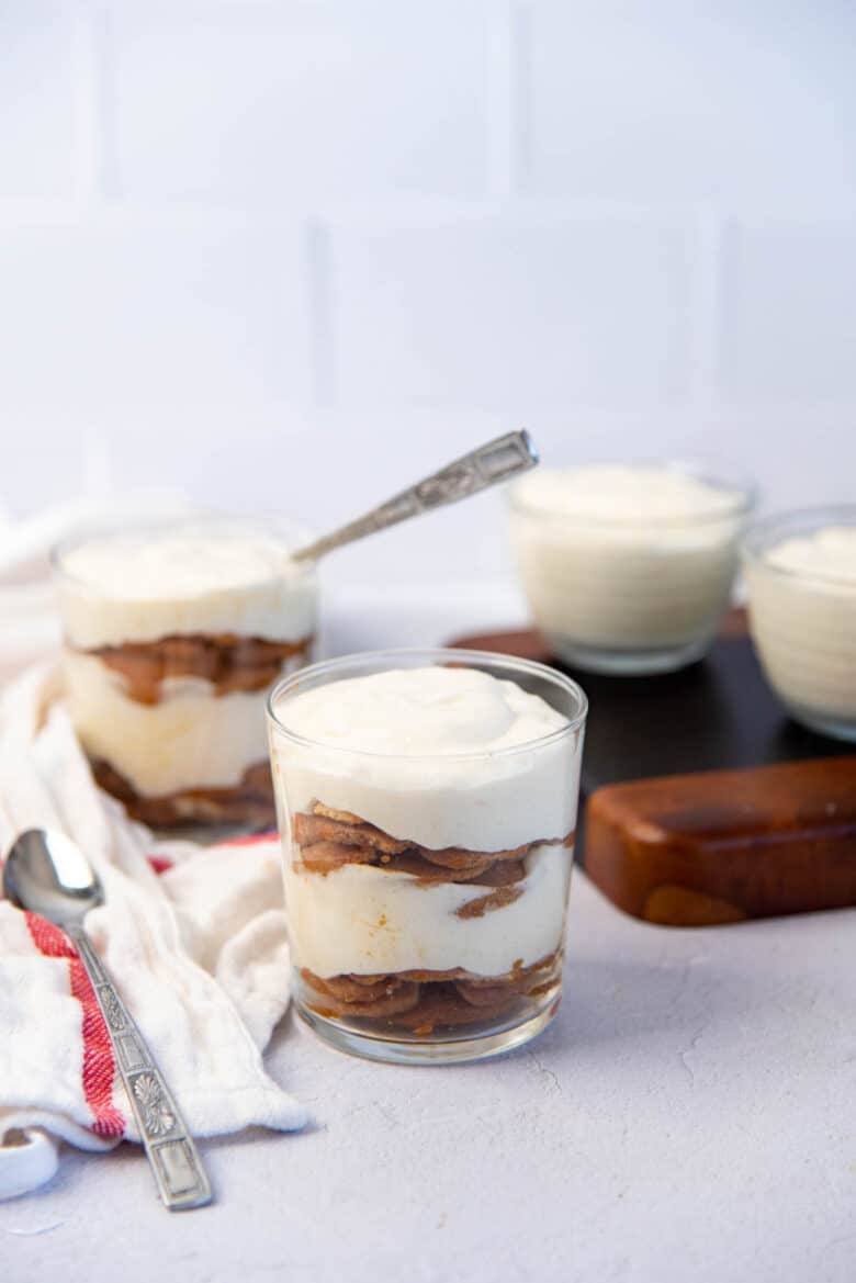 Three servings of creme chiboust trifle with coffee soaked vanilla wafers layered in between.