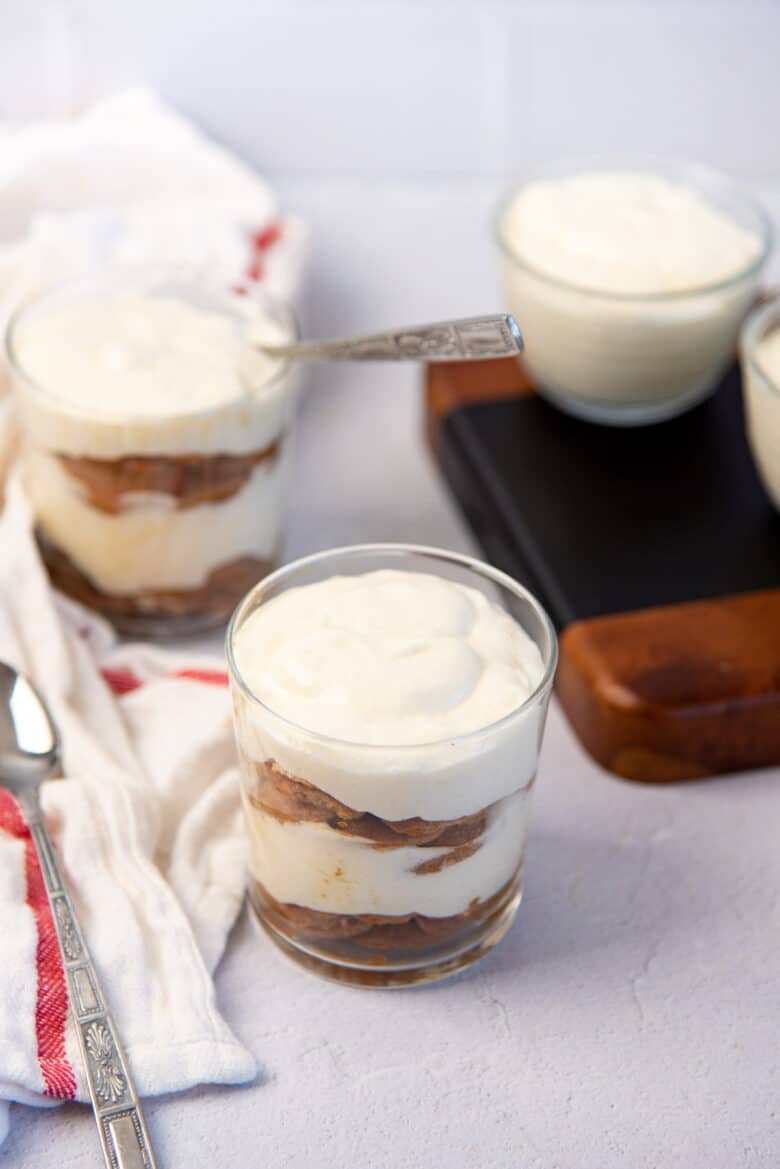 Coffee soaked vanilla wafers and Creme chiboust layered trifle in glasses.