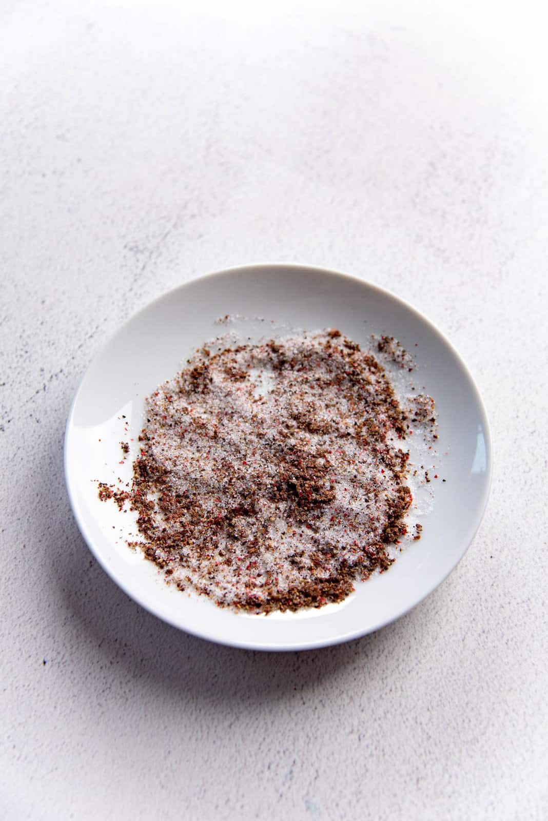 Seal salt and ground pepper on a small a white plate