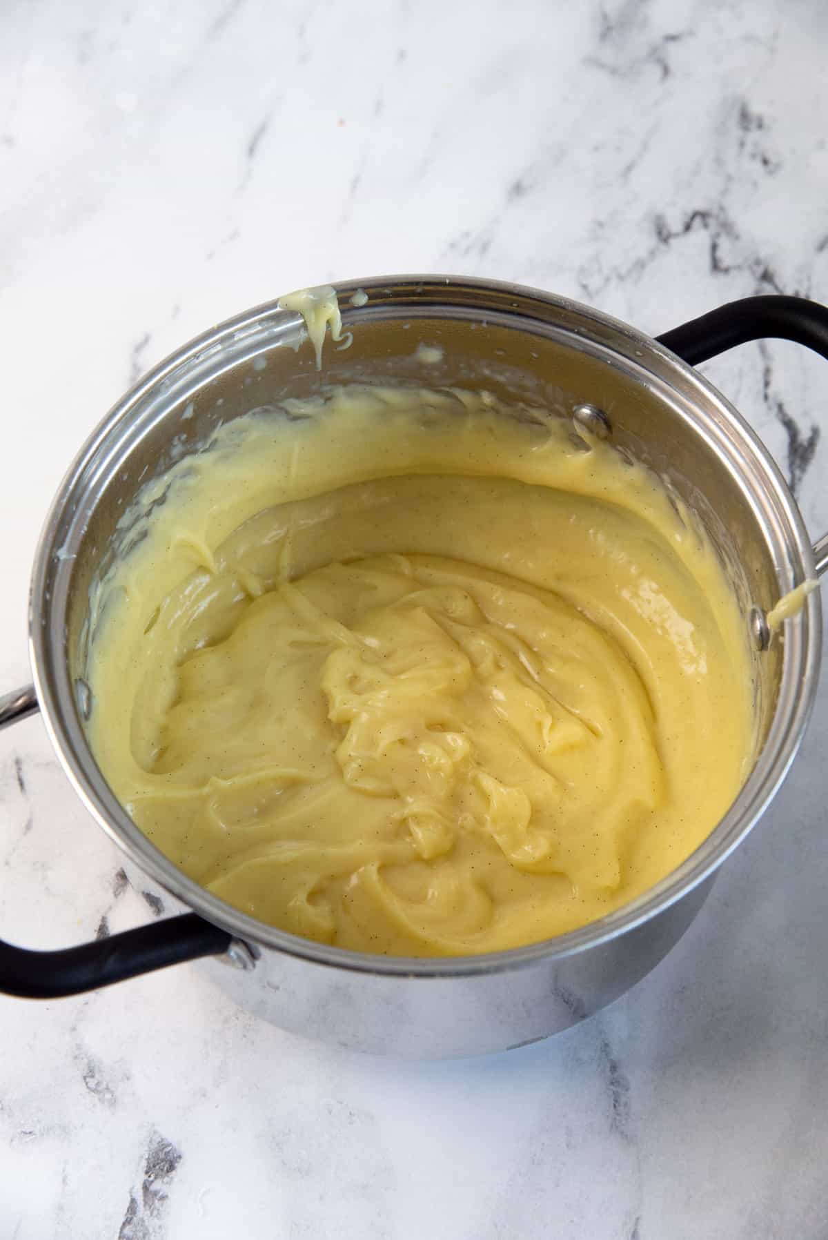 Pastry cream in a saucepan, after thickened and cooked through.