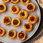 Jalapeno eye ball appetizers arranged on a plate.