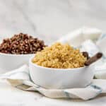 Close up of cooked, fluffy white quinoa in a small bowl.
