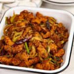 Sri Lankan hot butter cuttlefish dish served in a white bowl.