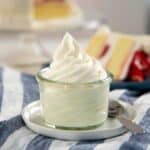 Stabilized whipped cream in a small glass jar.